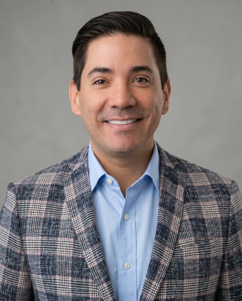 Profile portrait, facing forward in a blue shirt and blazer